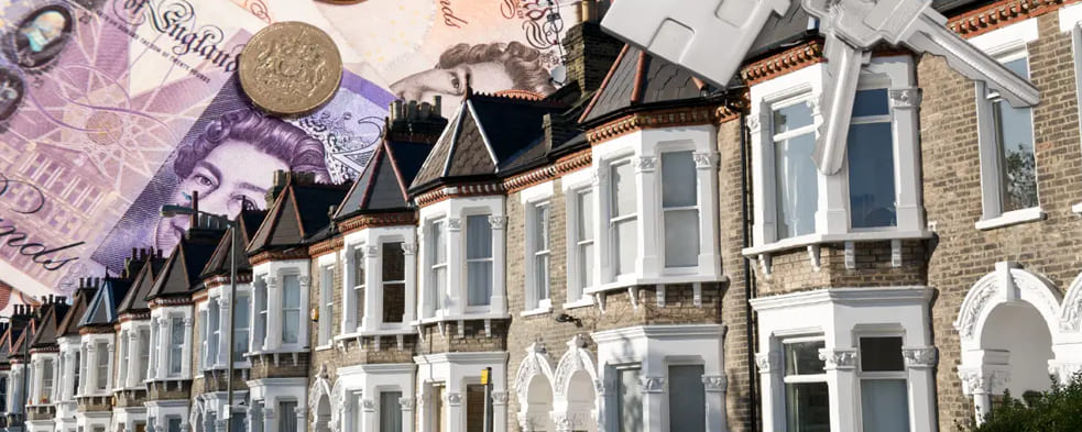 UK terraced houses with cash and keys representing cash home buyers